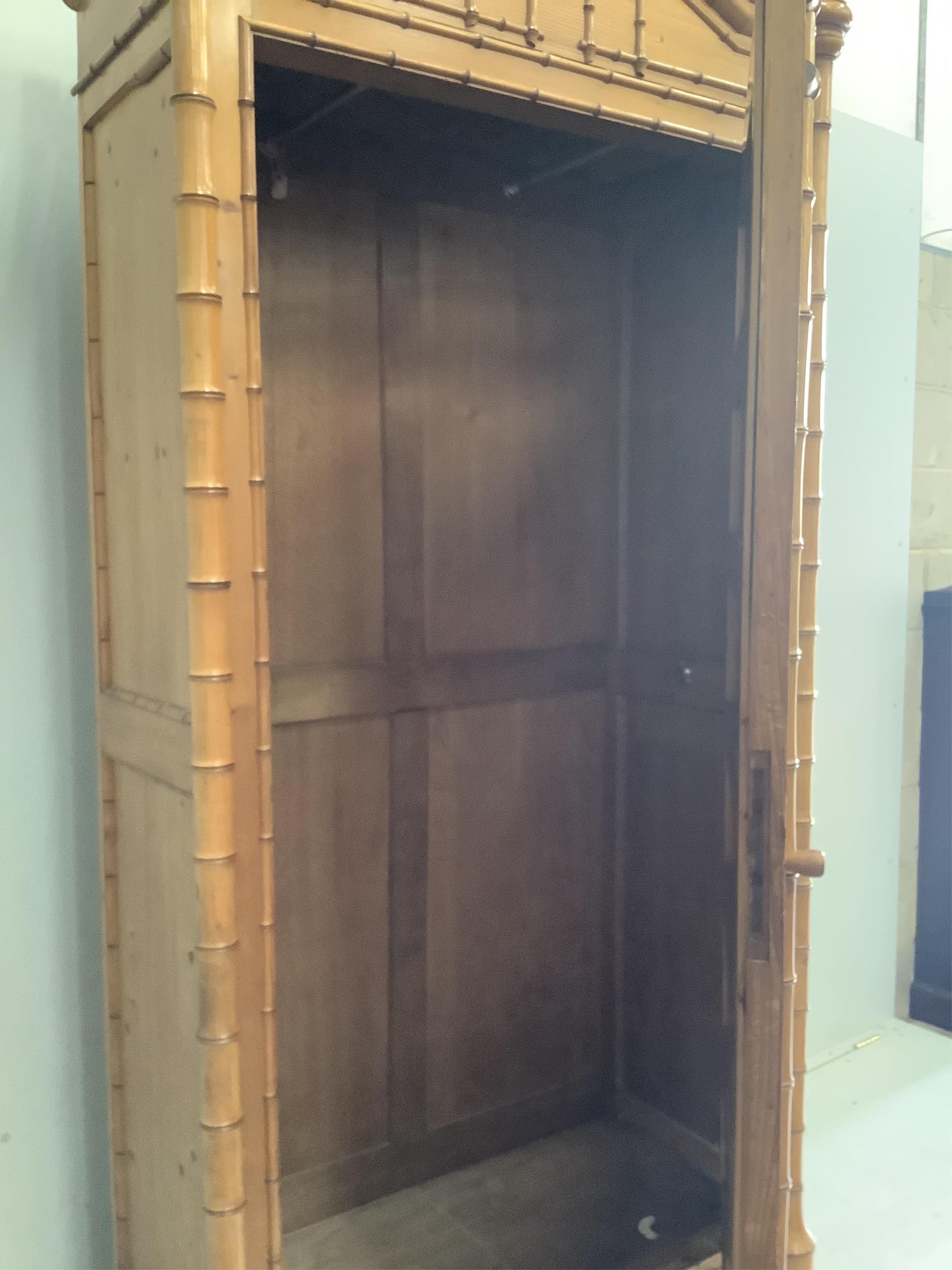 A late Victorian pitch pine faux bamboo mirrored armoire, width 98cm, depth 44cm, height 228cm. Condition - good
